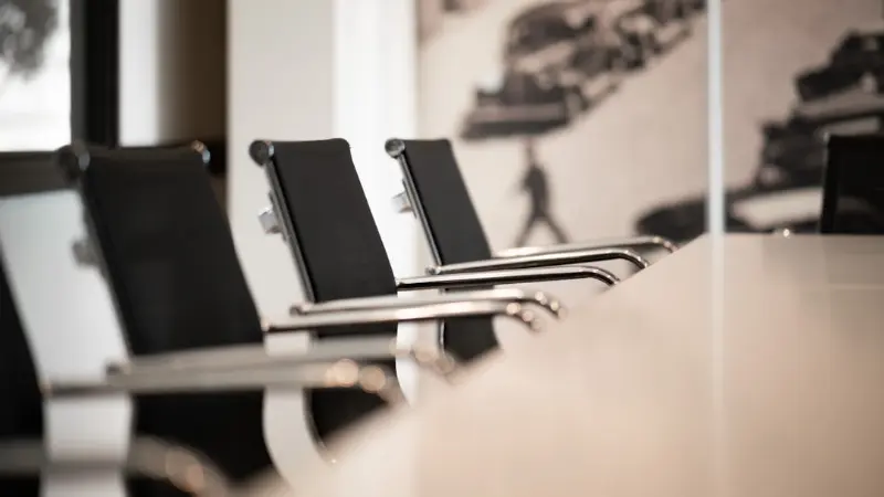 Empty boardroom chairs before a meeting