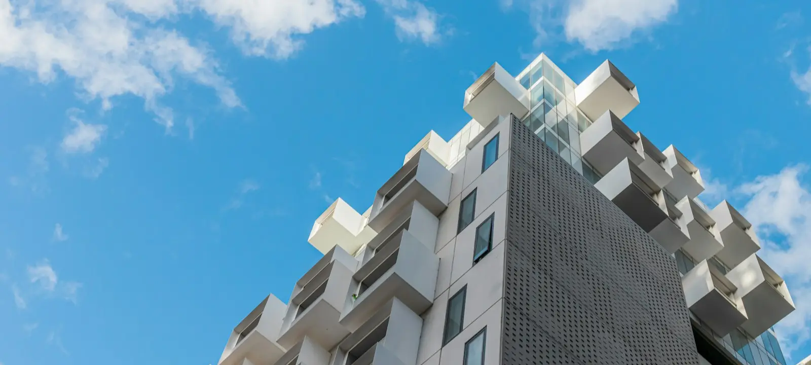 Condo building against a blue sky