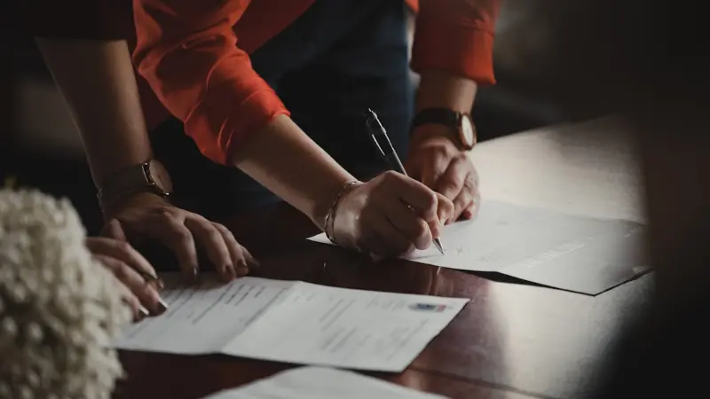 Person signing management documents